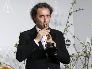 Paolo Sorrentino, director of Italian film "The Great Beauty" poses with his award for best foreign language film at the 86th Academy Awards in Hollywood